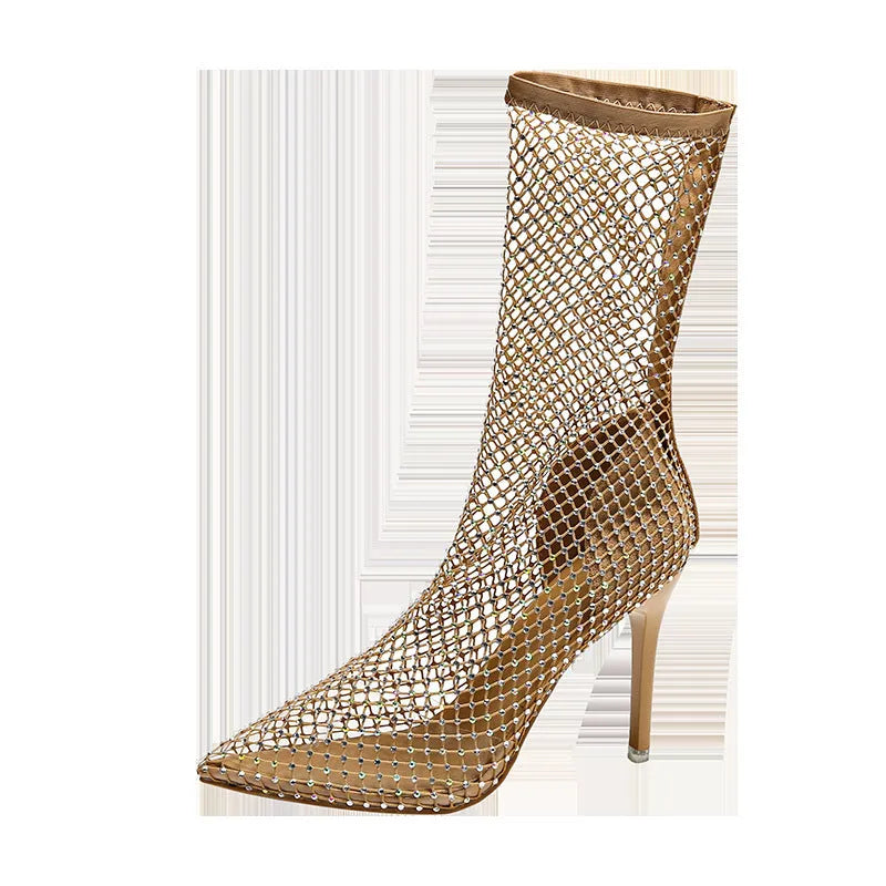 Gold mesh high heel sandals with pointed toes and stiletto heels on a rubber sole.