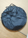 Black pop-up car tail tent with quick-throw setup shown connected to vehicle