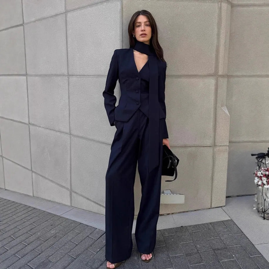 Women's navy blue halter suit set with polyester top and full-length trousers in sizes S M L