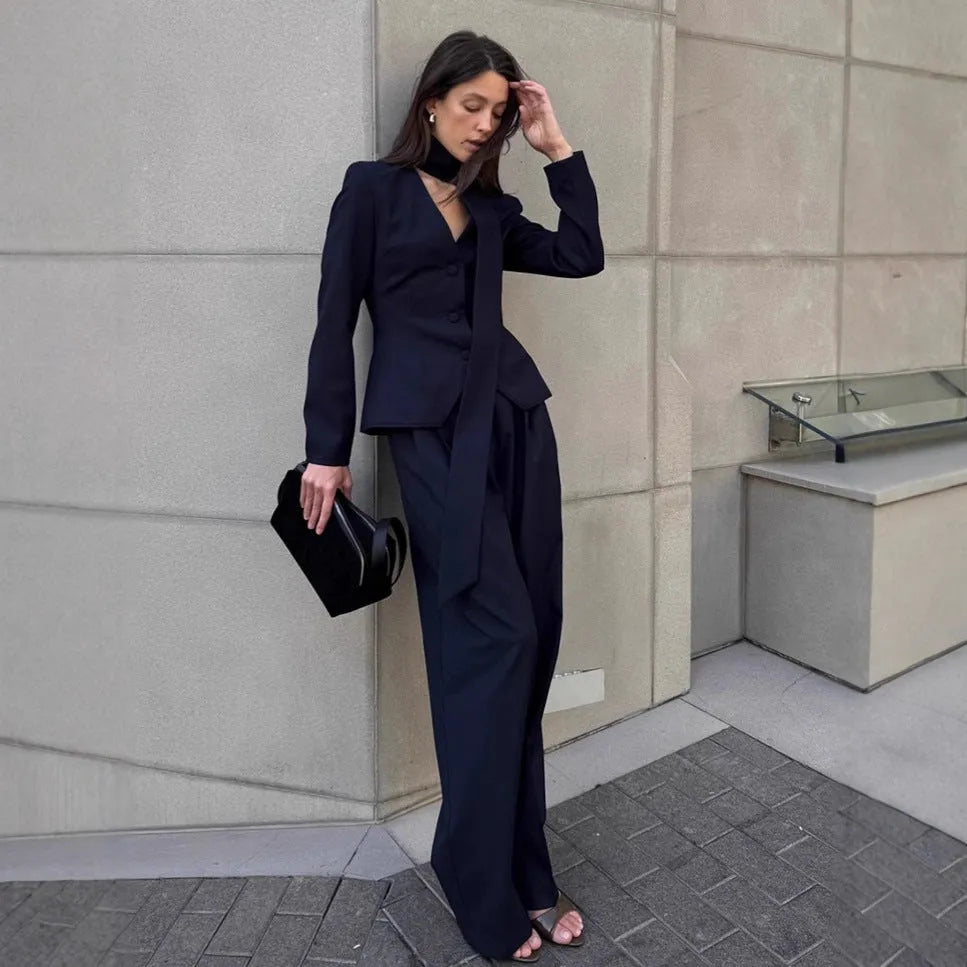 Women's navy blue halter suit set with polyester top and full-length trousers in sizes S M L