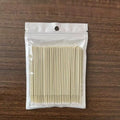 Disposable micro applicator brushes with bendable cotton tips and colour-coded handles for eyelash extensions