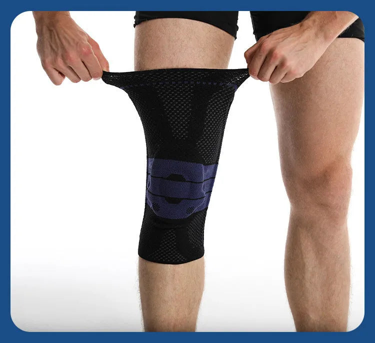 Adult black and blue sports knee pads made from nylon and spandex, shown on a knee.
