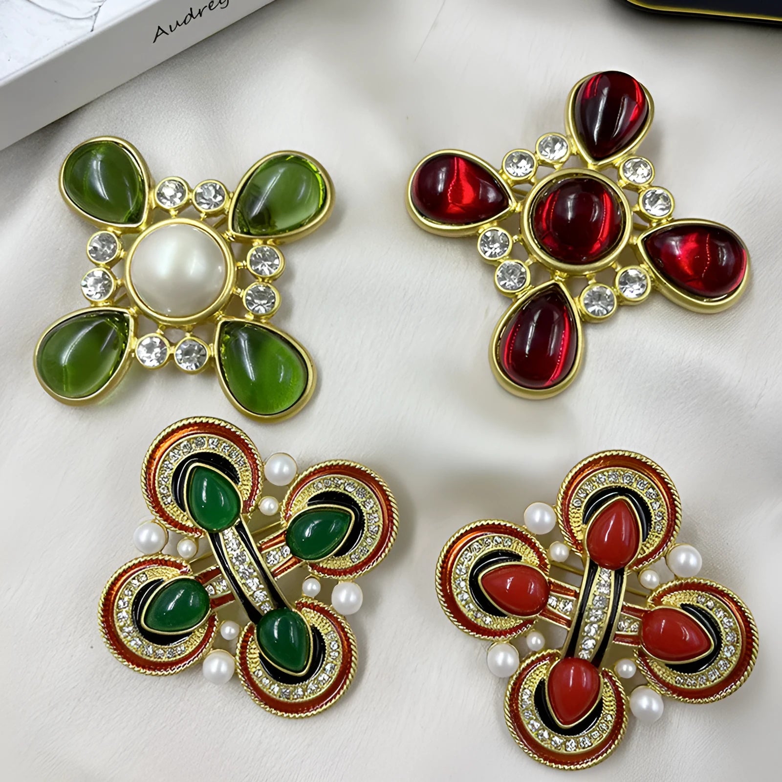 Classic vintage zinc alloy brooch with baroque-style cross design and crystal details on a dark background.