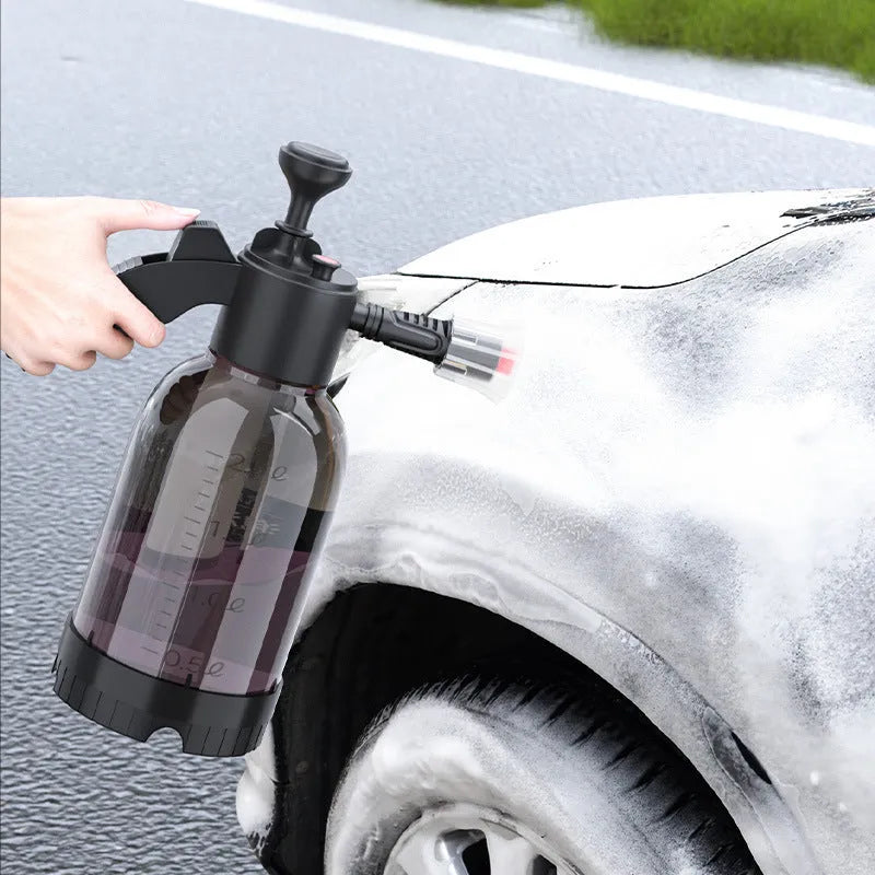 Black hand-held foam watering can with switch lock and two nozzles for garden and vehicle use