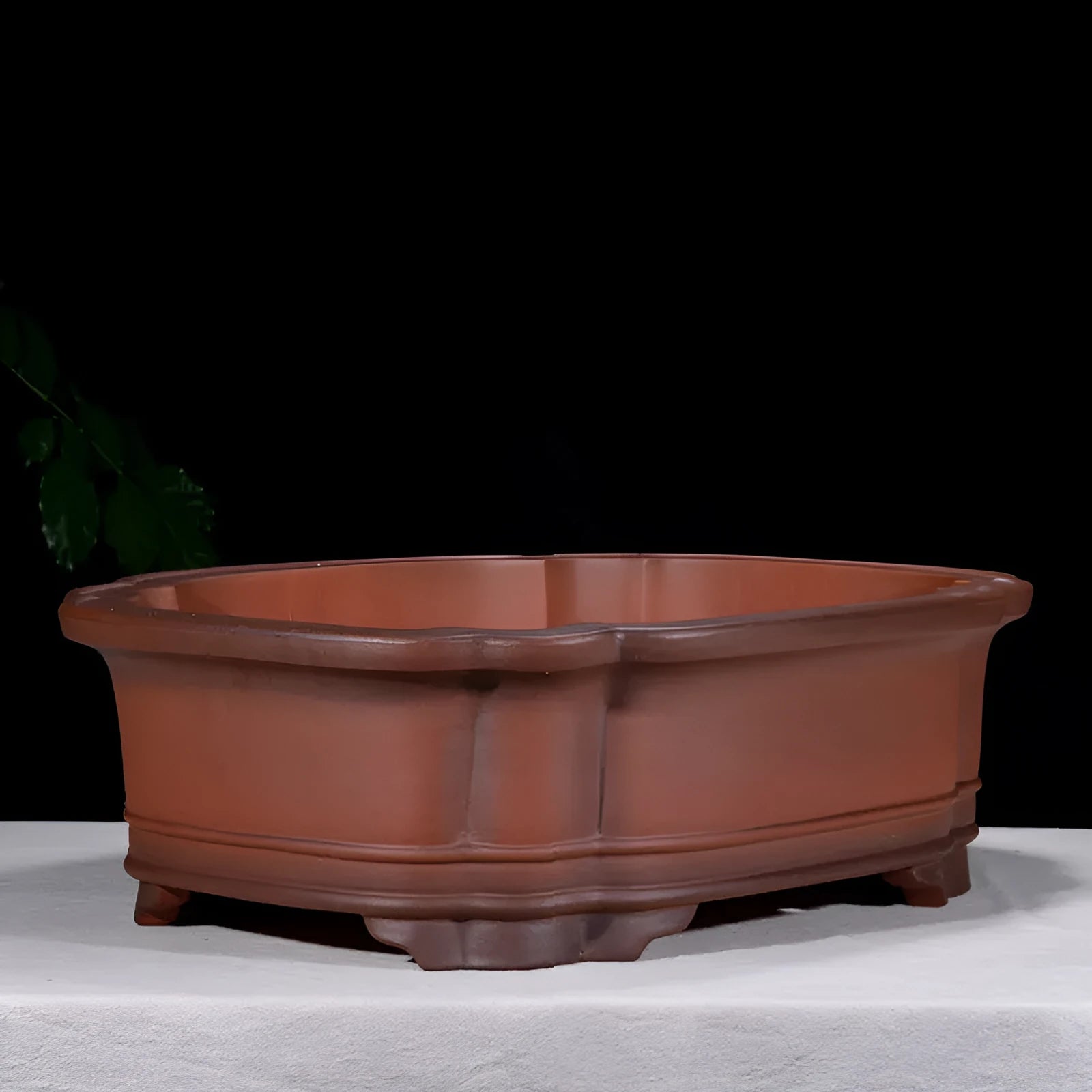 Large antique-finish Chinese purple clay flower pot with decorative tree stump and floral motifs.