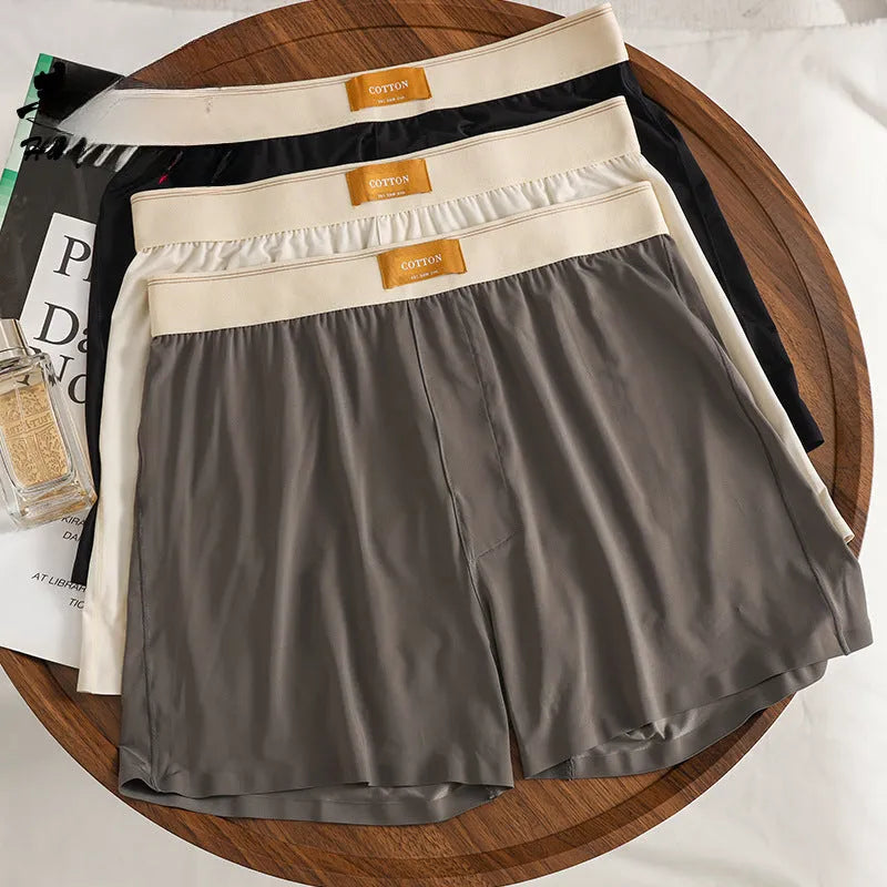 Pack of three men's loose fit solid colour underwear in ice silk fabric.