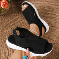 Women's flat platform sports sandals in black with mesh lining and a rubber sole.