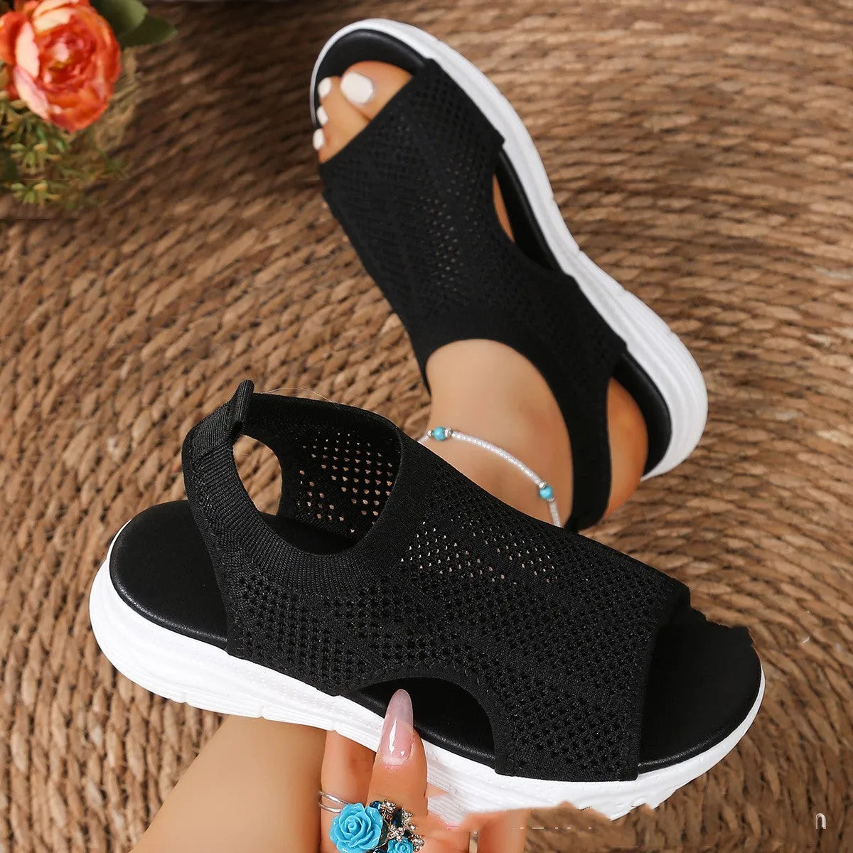 Women's flat platform sports sandals in black with mesh lining and a rubber sole.