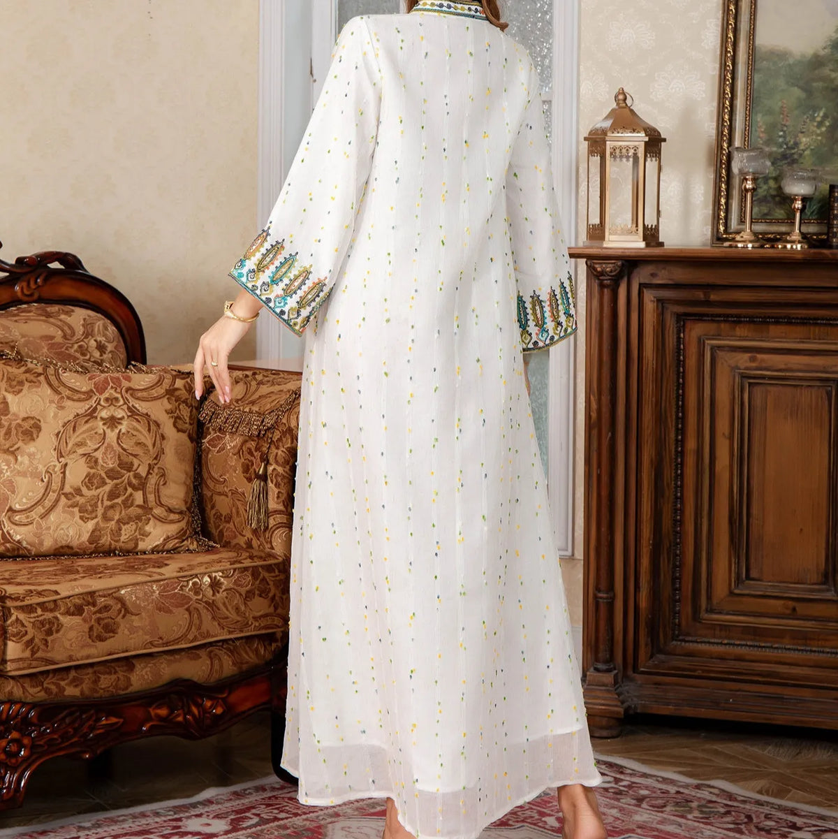 White full-length Arabic robe for women with long sleeves, made from polyester fabric.