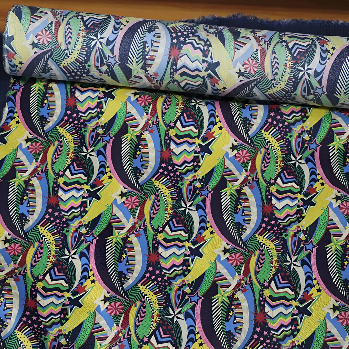 Blue cotton fabric with digital floral printing showing plant designs