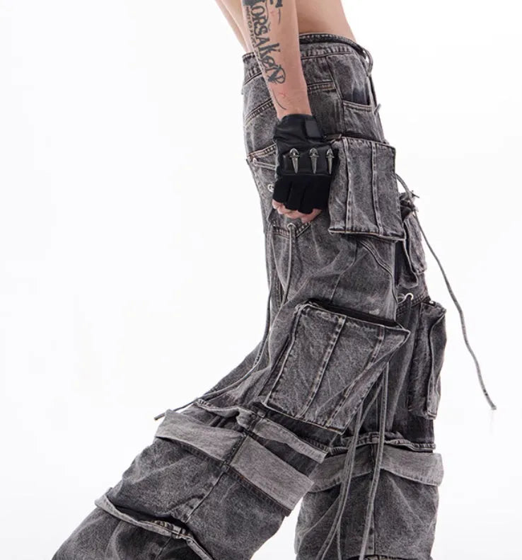 Grey distressed cotton denim men's overalls with rope stitching on the legs.