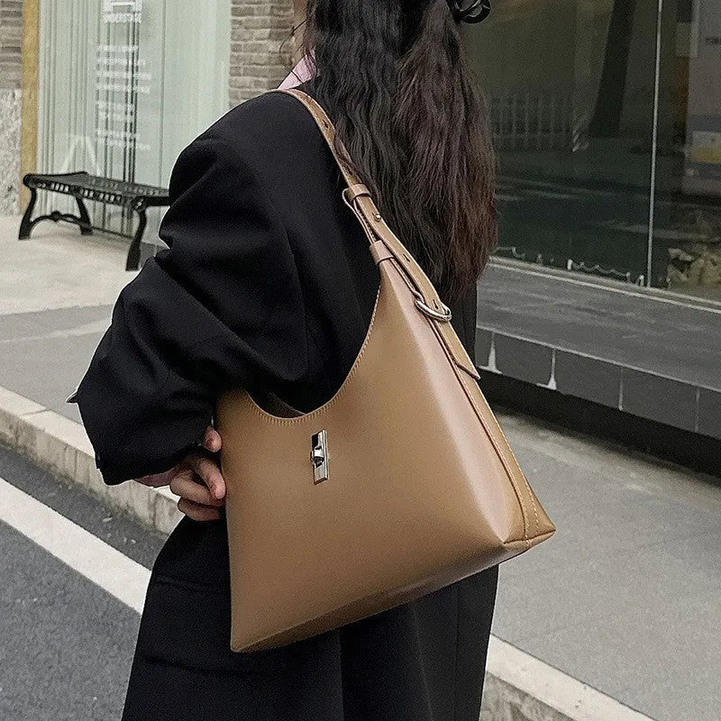 Genuine leather crossbody shoulder bag with dumpling shape and sandwich pocket design