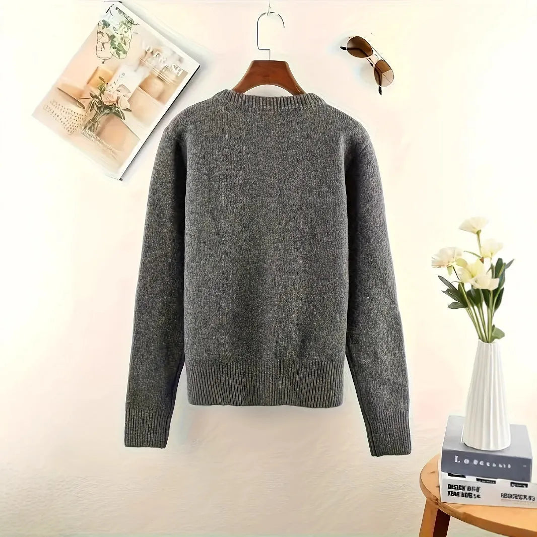 Dark grey women's button-front cardigan sweater with long sleeves on a hanger.