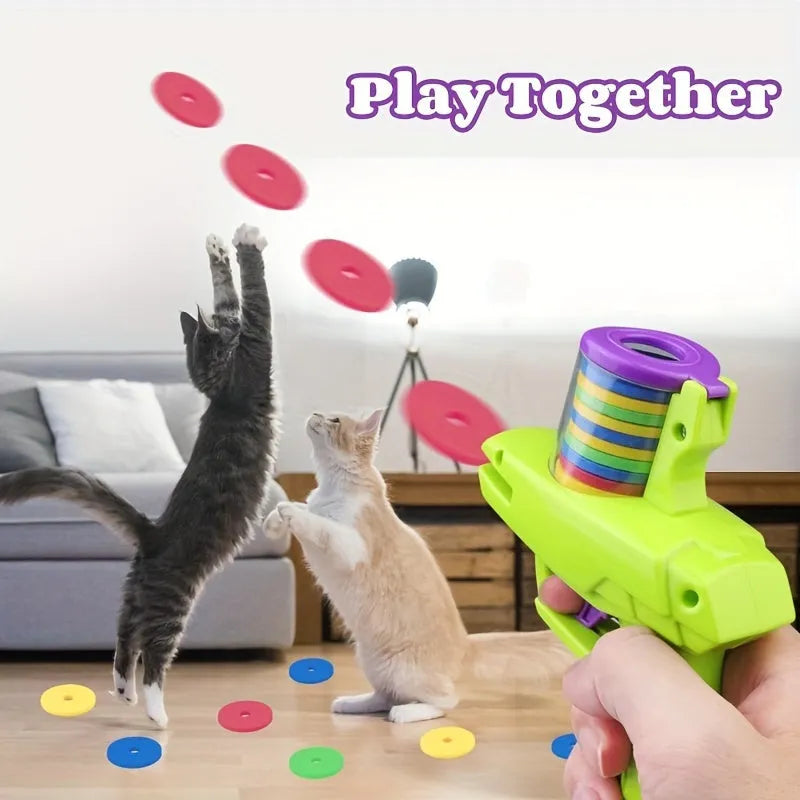 Green interactive battery-free cat toy launcher with foam disc on a floor.
