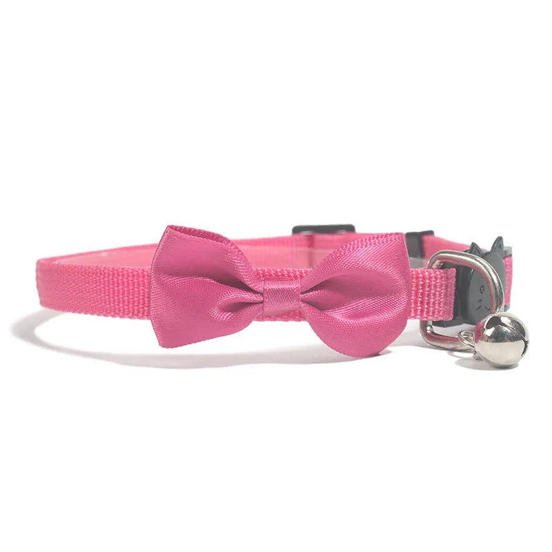 Adjustable striped nylon cat collar with bell in various colors including red, green, and blue
