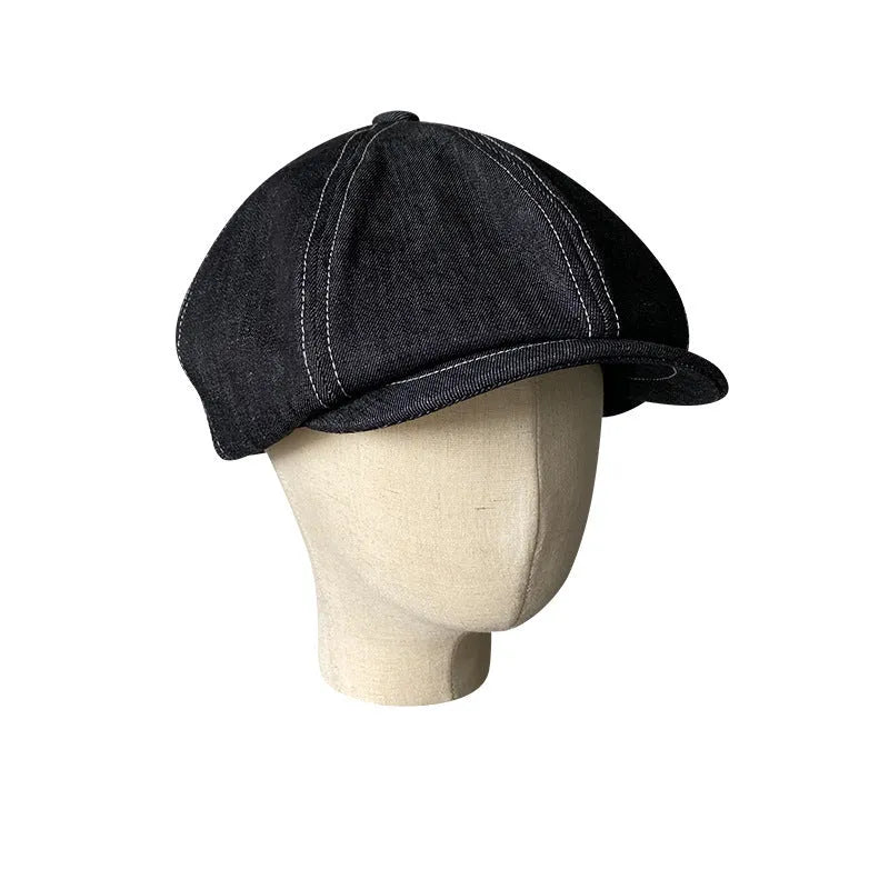 Black cotton retro beret with octagonal silhouette shown on model, unisex adult design