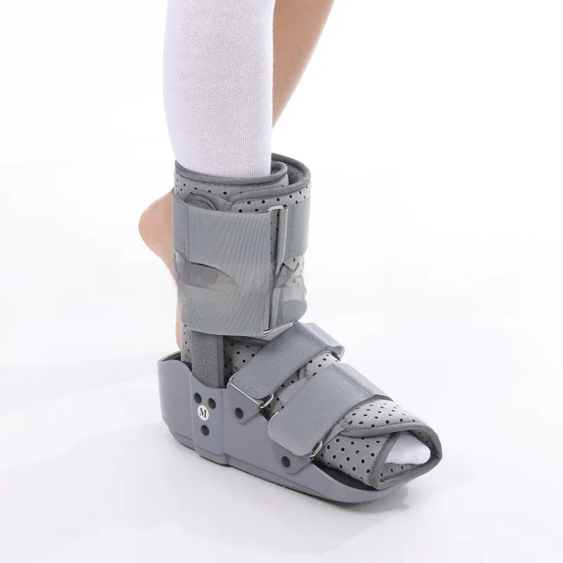 Achilles tendon rehabilitation walking boots in grey and black colours with adjustable straps
