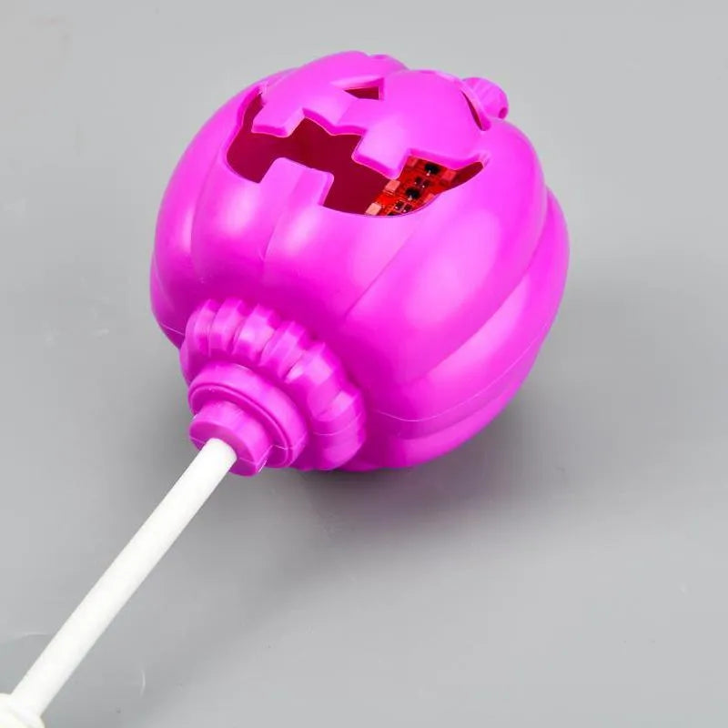 Plastic pumpkin lamp with USB charging cable in purple or yellow light colour