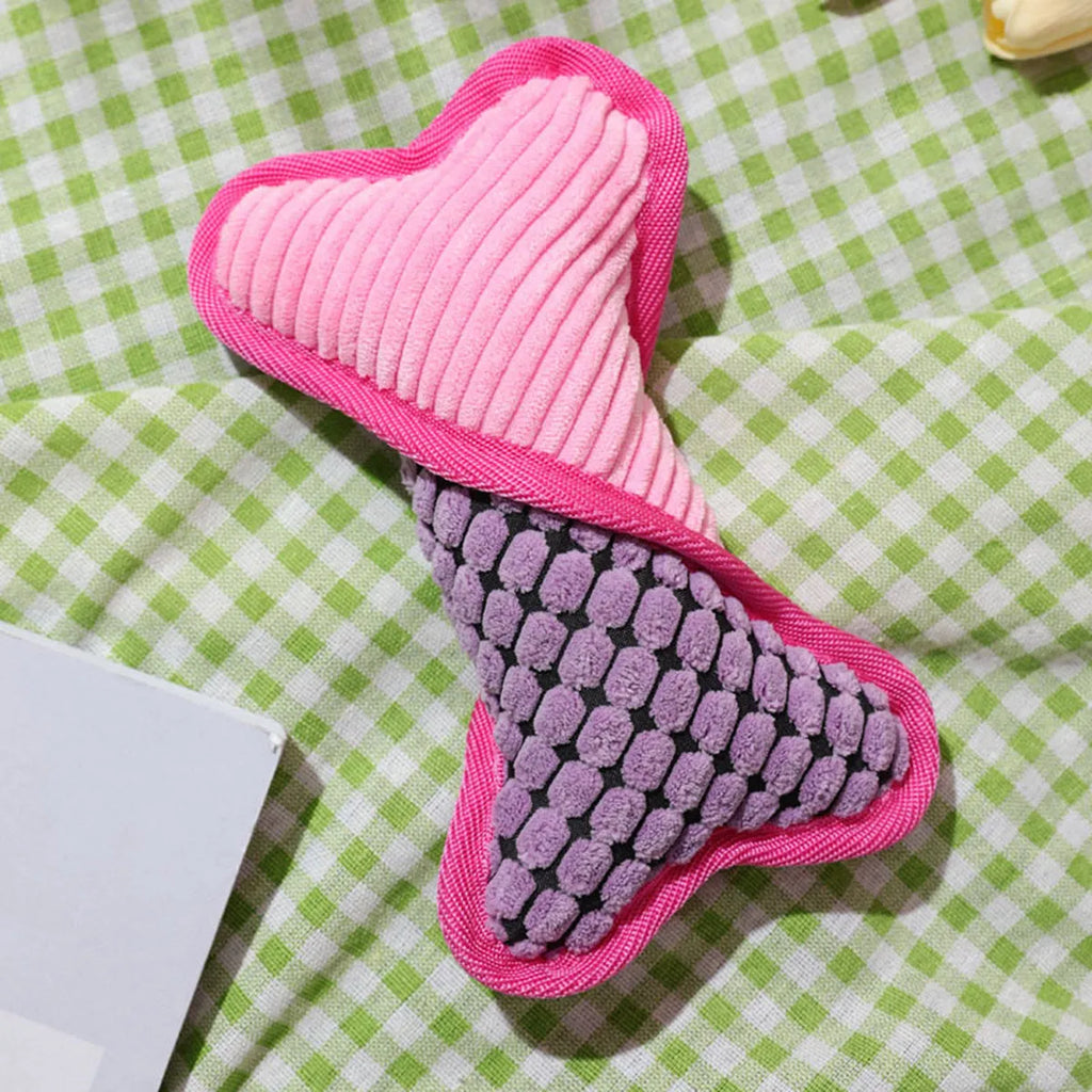 Blue dog toy with a squeaker bone, showing soft corn fleece lining and bite-resistant texture.