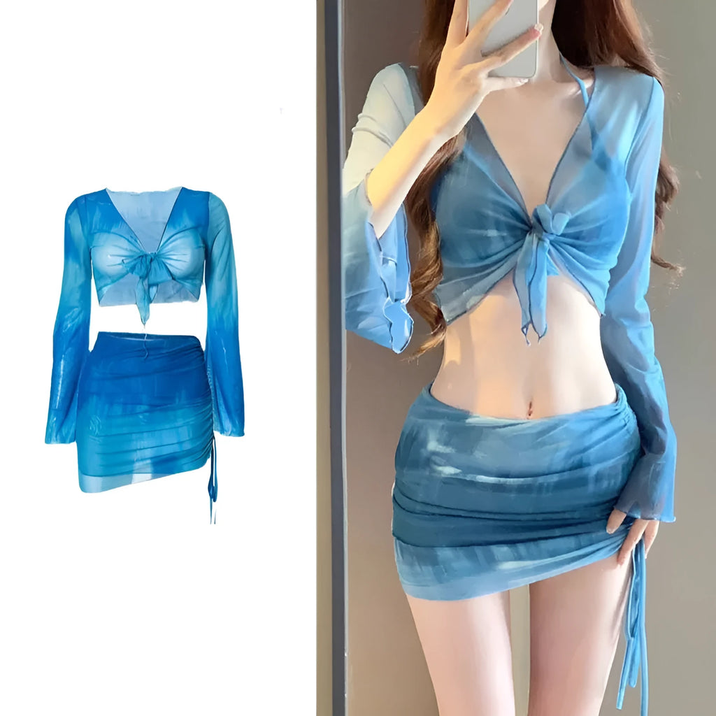 Blue four-piece women's bikini swimsuit set showing shirt, bra, underwear, and skirt with high-waisted design