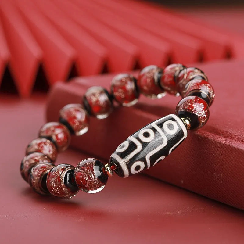 Chinese style lucky bracelet with colourful coloured glaze beads and auspicious patterns.