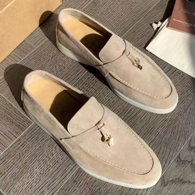 Slip-on high-top loafers in light gray with round toe and rubber sole.