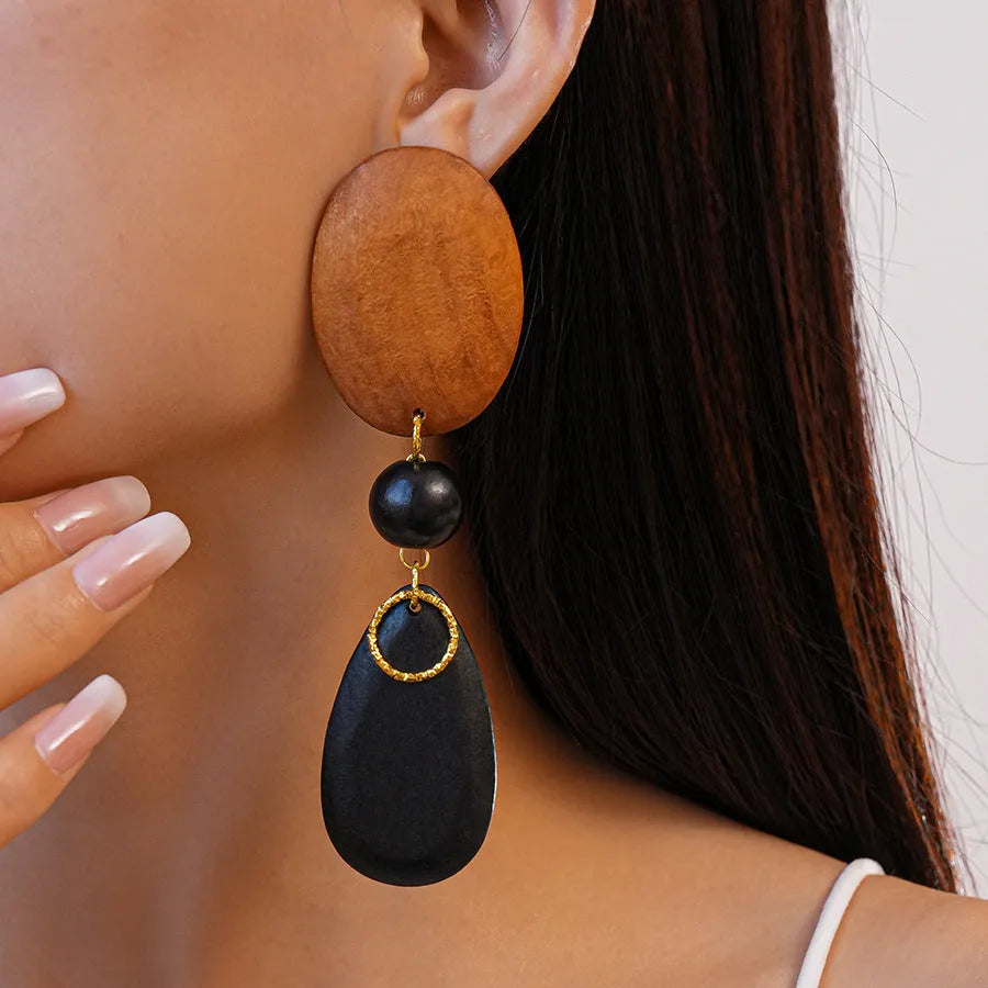 Handmade wooden retro earrings with elliptical shape in silver needle-brown-black colour combination