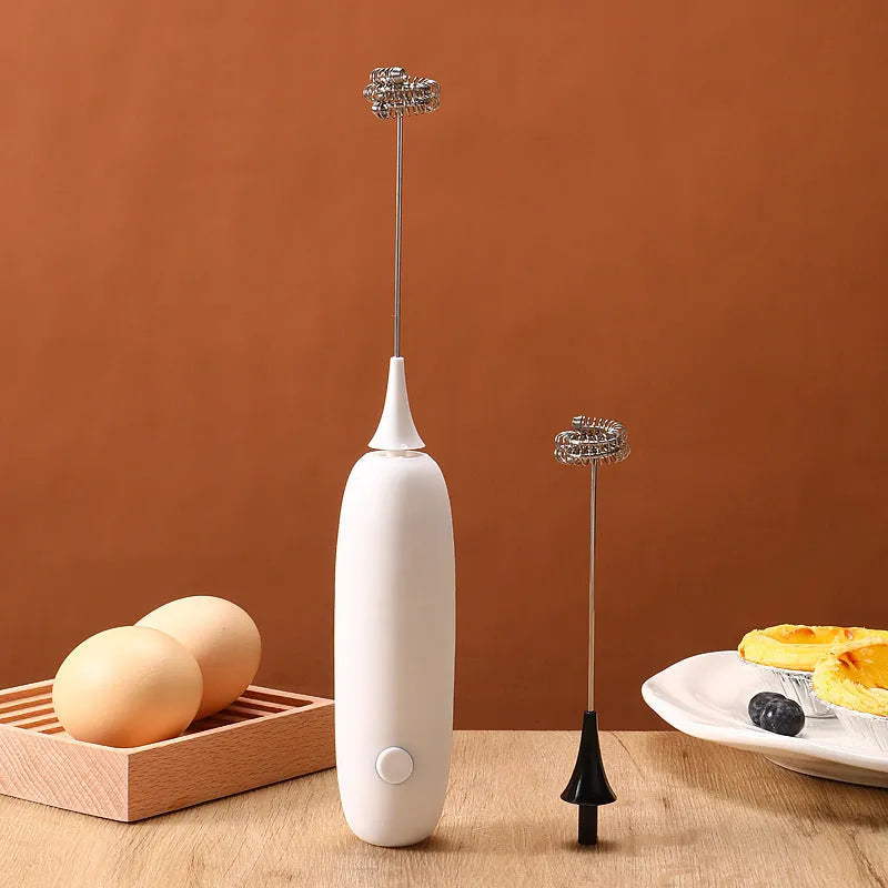 Hand-held electric milk frother in black and white colour options