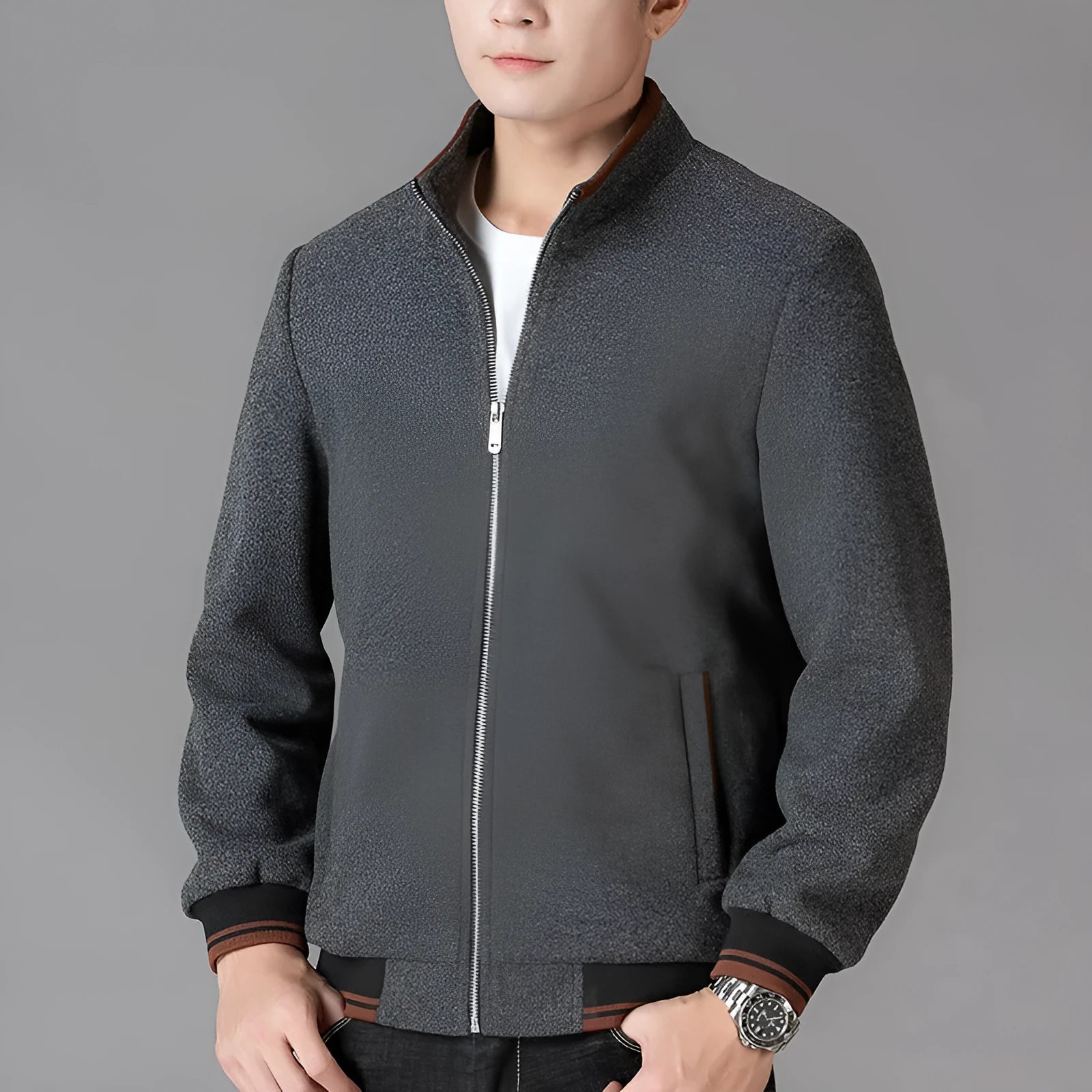 Men's grey polyester fleece sports jacket with long sleeves and a stick pocket.