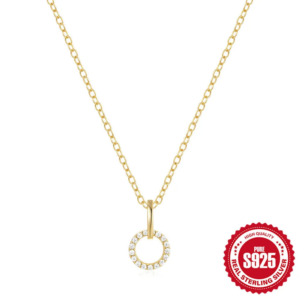 Gold-coloured S925 sterling silver clavicle chain with an interlocking geometric zircon pendant.