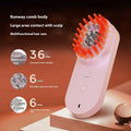 Pink and black smart massage comb for scalp care with red light therapy.