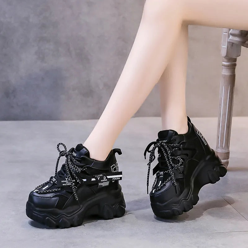 Women's white breathable mesh platform sports shoes with a cross strap and rubber sole.