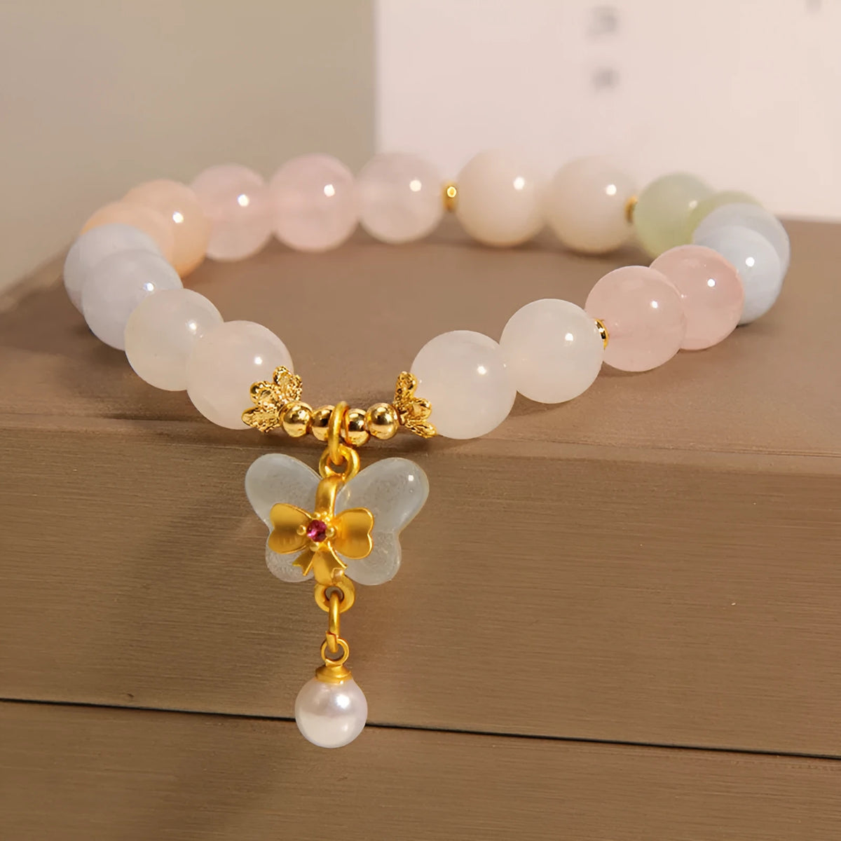 Women's crystal bracelet with a colourful morganite butterfly pendant in an original design.