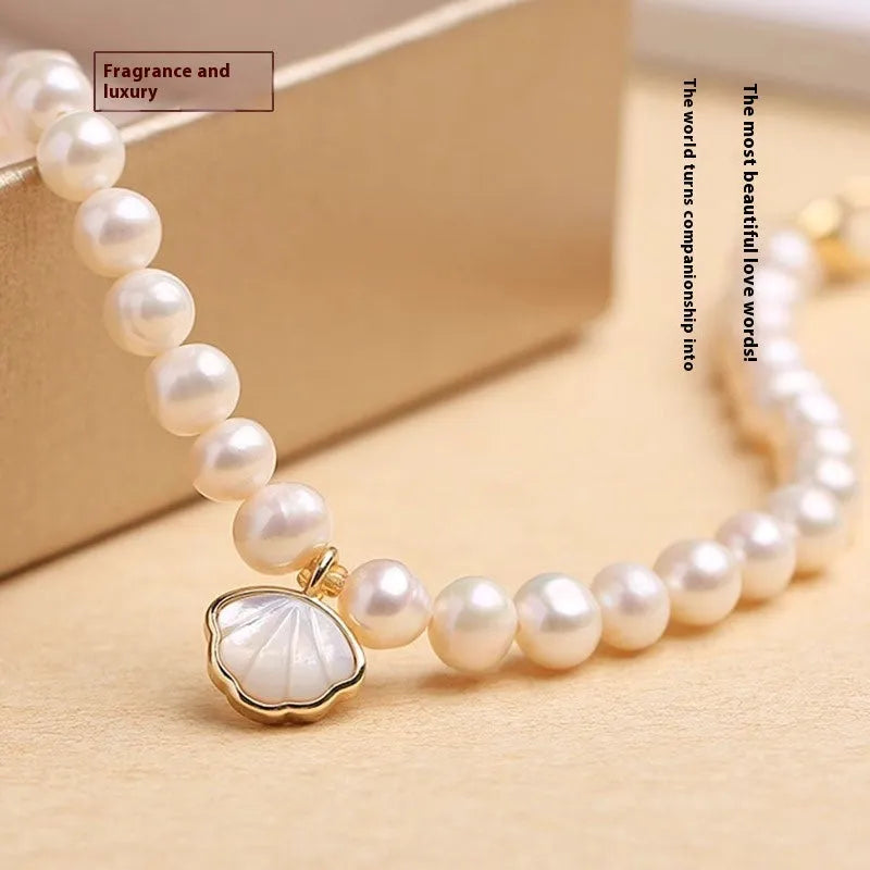 Women's freshwater pearl bracelet with fan-shaped design and elastic or chain fastening options