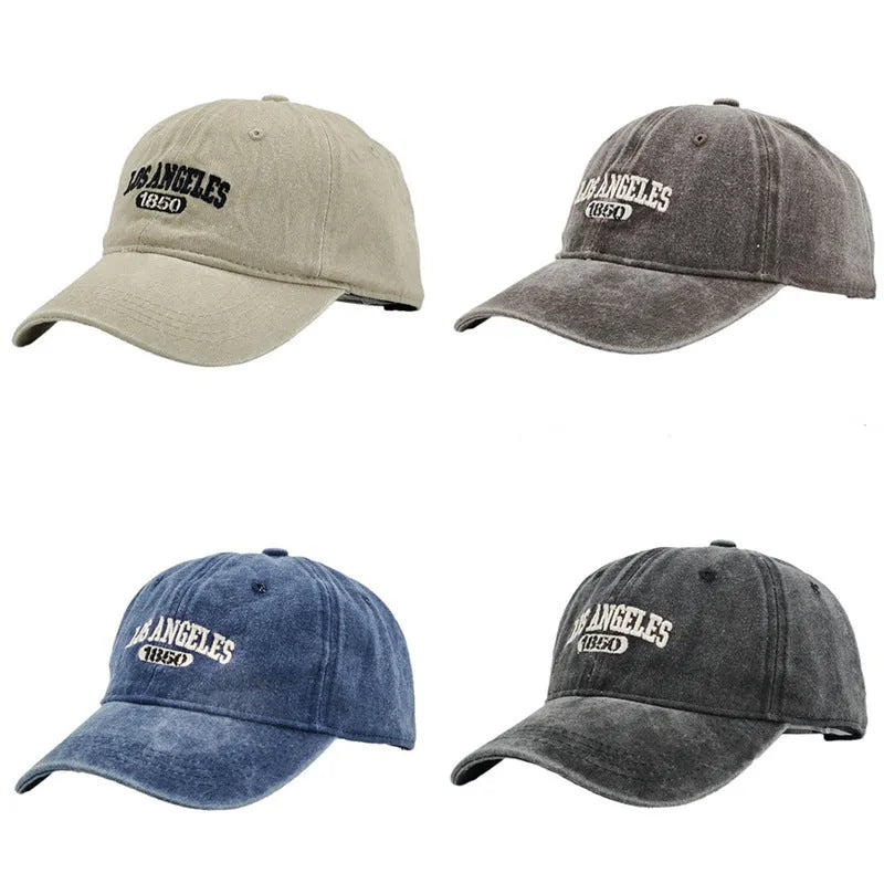 Retro personalised washed distressed embroidered peaked cap in beige colour on a wooden background