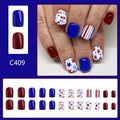 Short glossy press-on nails with strawberry and cherry图案 in red and blue colours