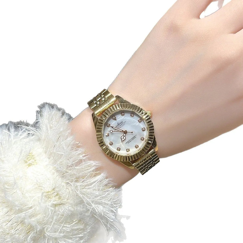 Women's rose shell dial watch with 7mm slim case, shown with leather or steel strap options