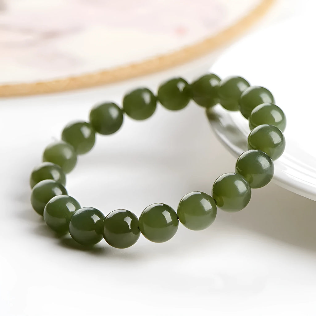 Hetian jade bead bracelet in ice-like clear colour on a white background.