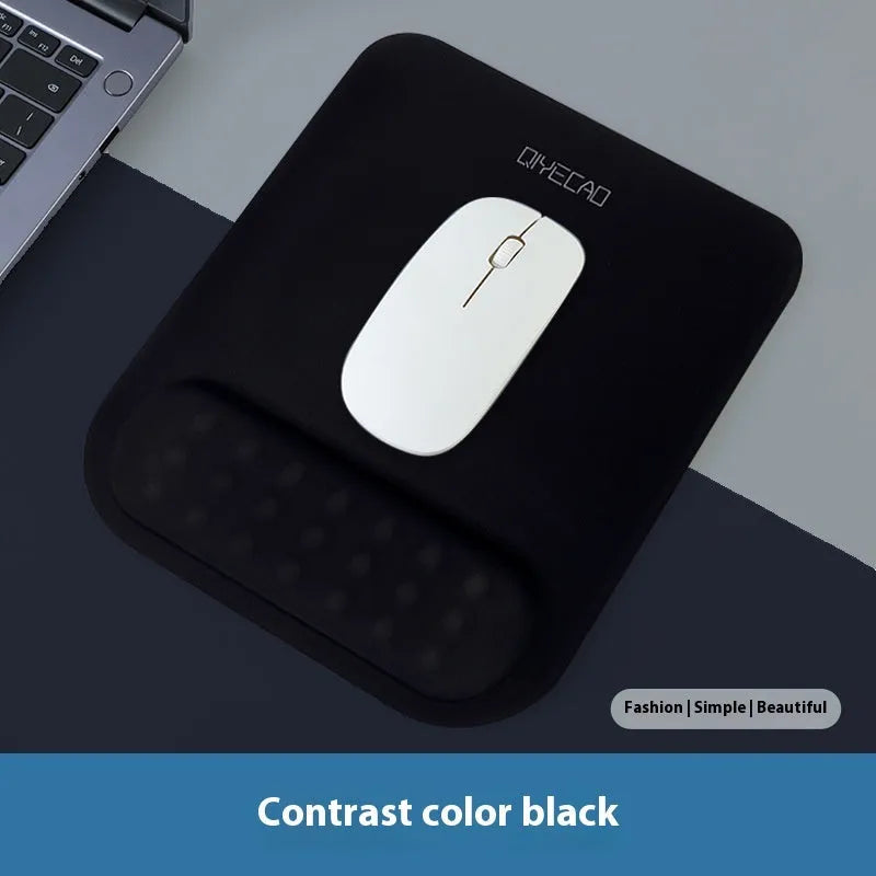 Ergonomic cloth-silicone mouse pad with raised wrist support on a desk