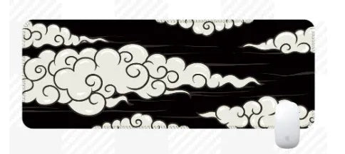 Large rectangular cloud pattern mouse pad and desk mat in natural rubber on a wooden desk.