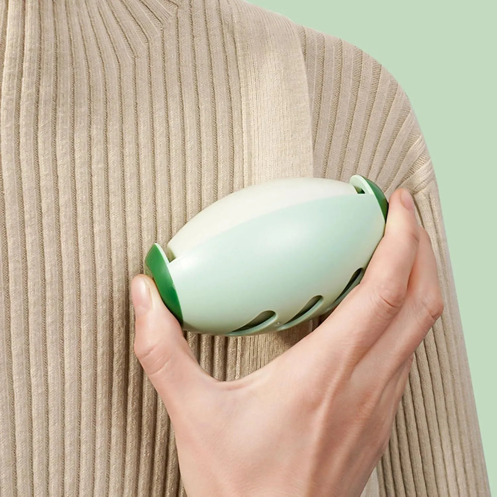 Green reusable gel lint roller ball for pet hair removal from clothes and furniture