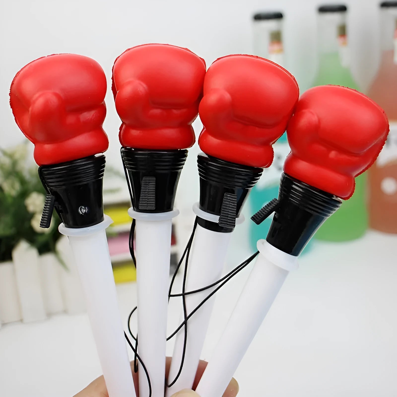 Four boxing press ejection pens with pressure relief mechanism and black ink refills