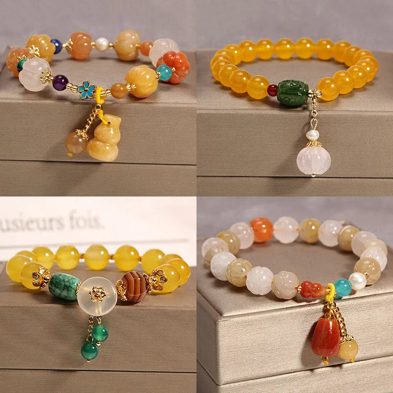 Yellow agate crystal bead bracelet with khaki silk cord and gold tone sliding closure.