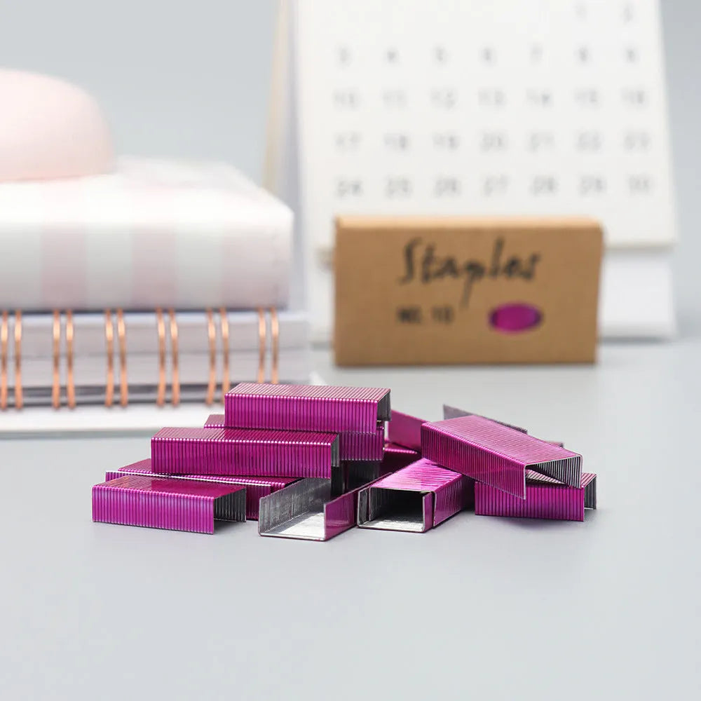 Box of 1000 metal office staples in black, purple, rose gold, and rose red colours
