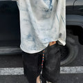 Loose fit round neck t-shirt in solid color with Korean style dirty print and washed aging effect.