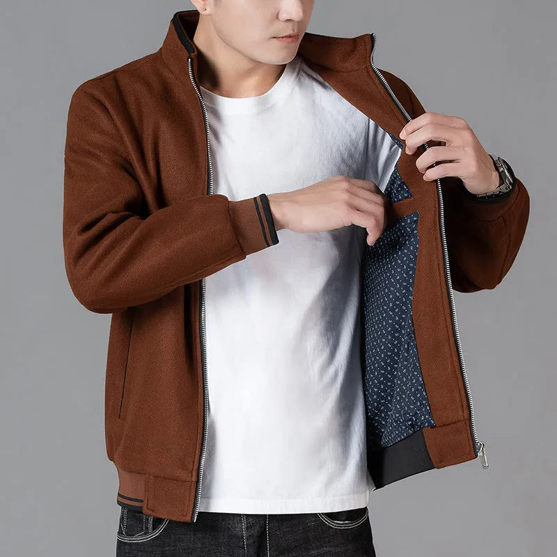 Men's grey polyester fleece sports jacket with long sleeves and a stick pocket.