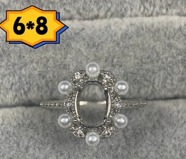Oval denier ring ornament with open mouth design, 6x8mm stone and five-pointed star detail