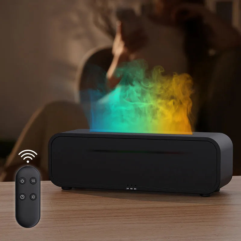 Black aroma diffuser with colour-changing flame light effect and remote control on a table.