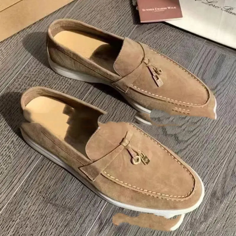 Slip-on high-top loafers in light gray with round toe and rubber sole.