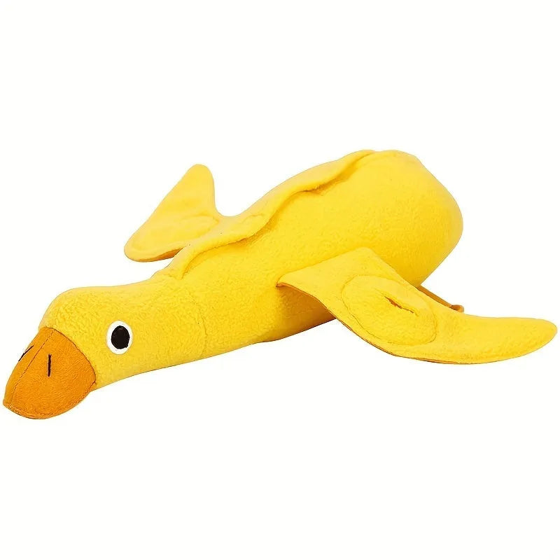 Yellow plush teddy dog toy with attached duck doll and food leak compartments for pet training
